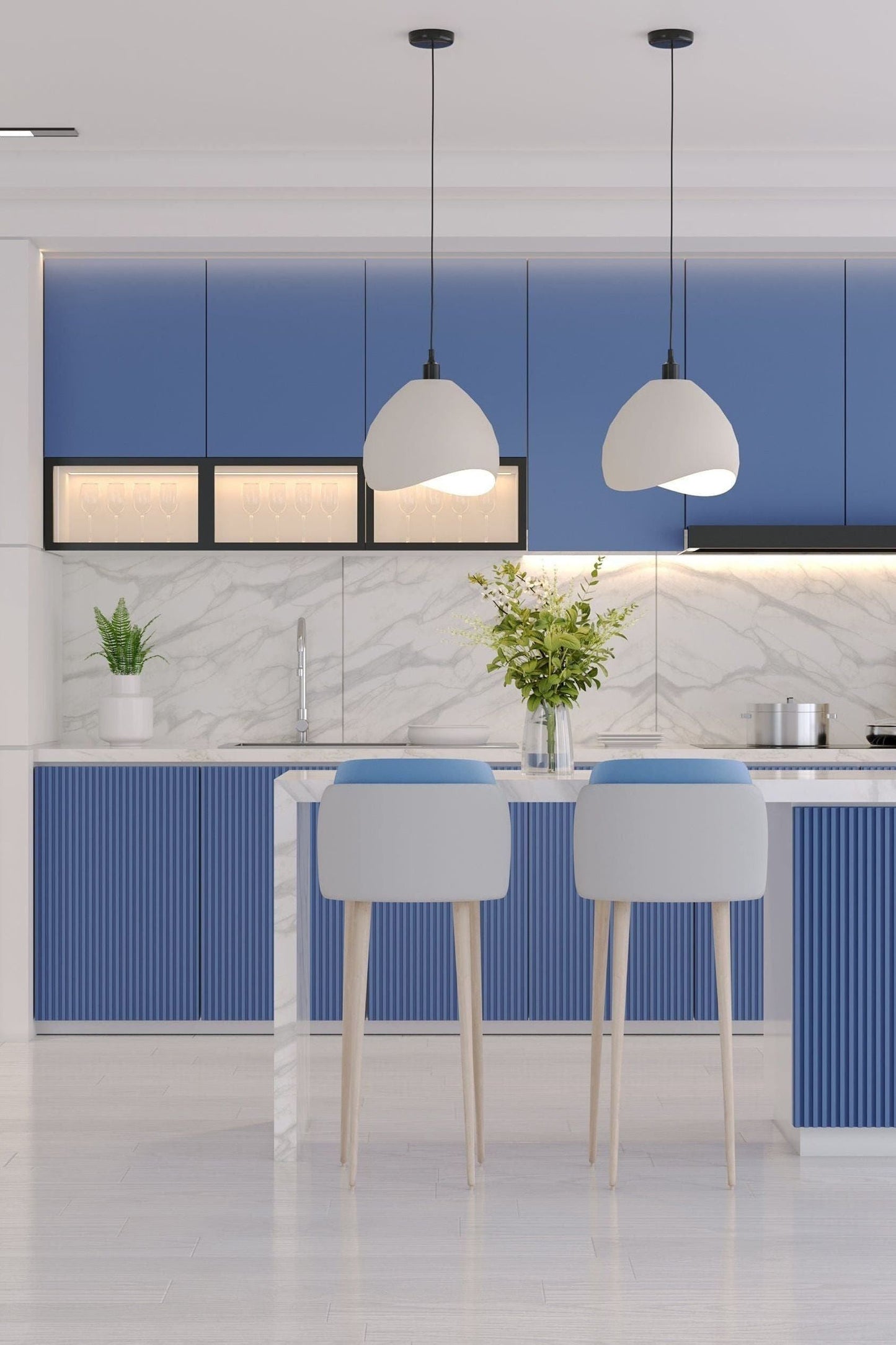 Modern kitchen with blue cabinets, white refrigerator, and white chairs.