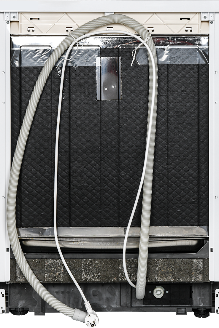 Back view of a vehicle with a hose attached, showing a textured black panel.