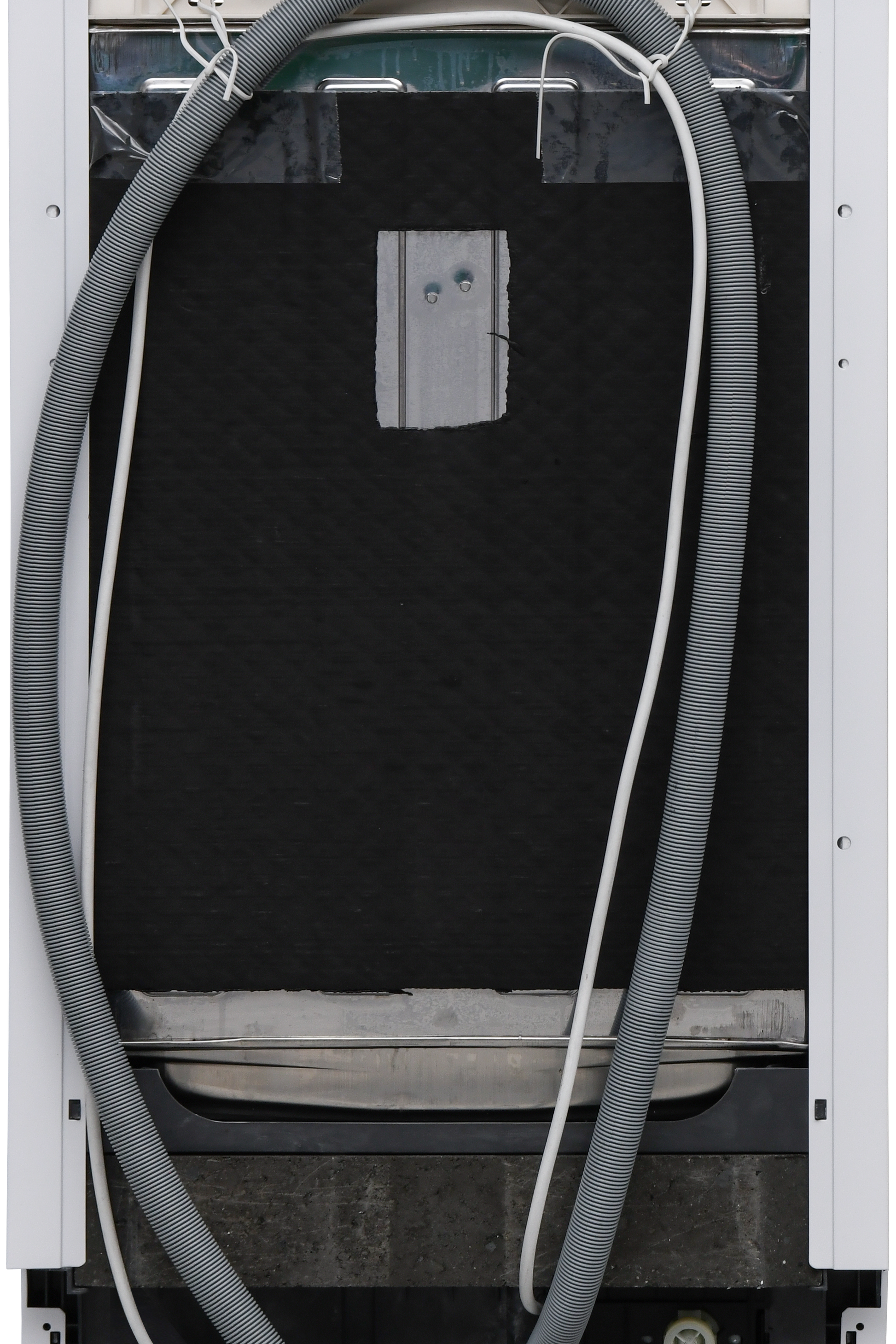 Back view of an air conditioning unit with a hose attached