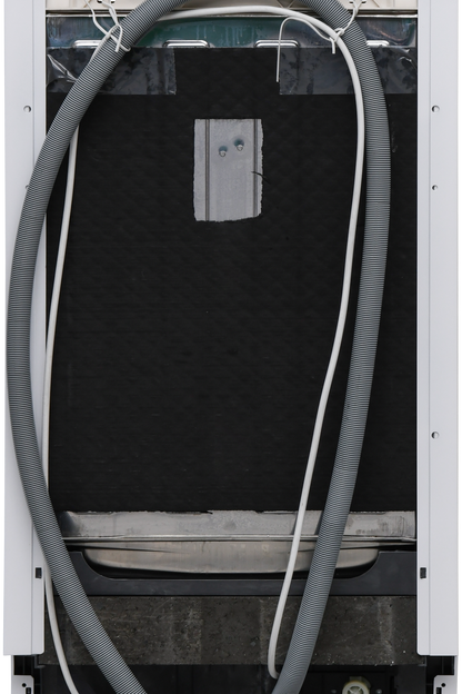 Back view of an air conditioning unit with a hose attached